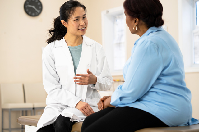 doctor talks with patient