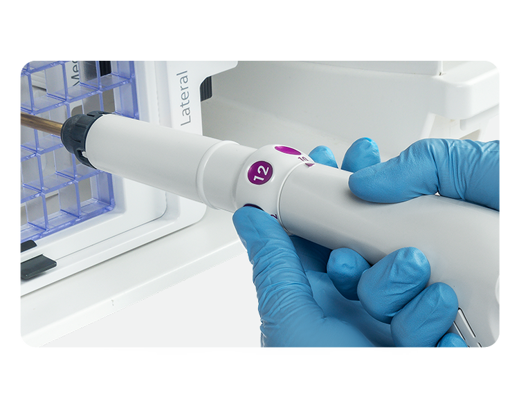 Gloved hands adjust aperture with probe knob on Mammotome Prima probe