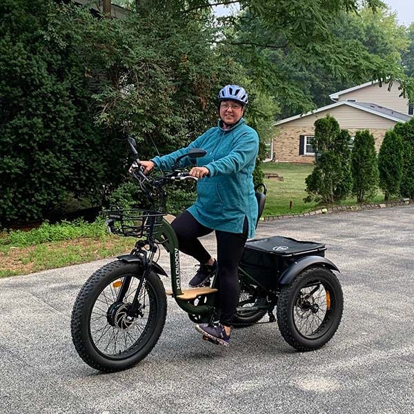 Rhonda Kops, Mammotome Senior Manager of Quailty Compliance, poses on a bike.
