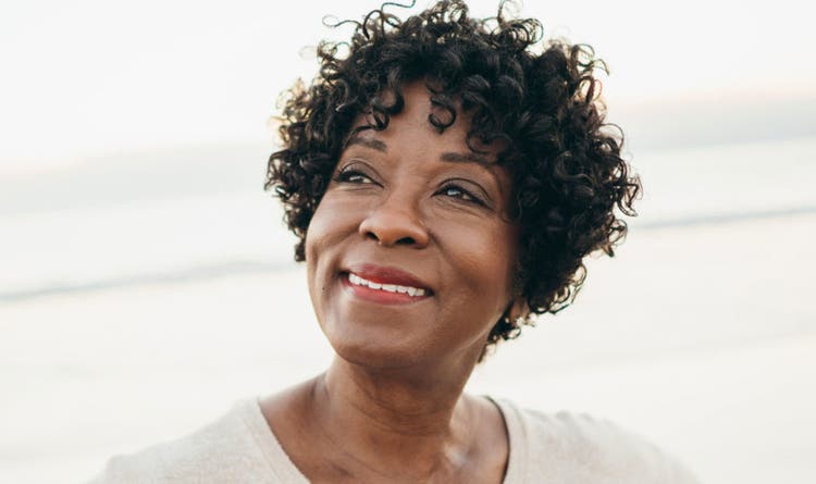 Woman smiling looking into the distance