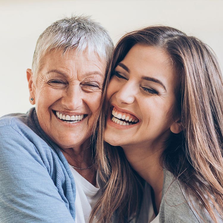 two women smiling together