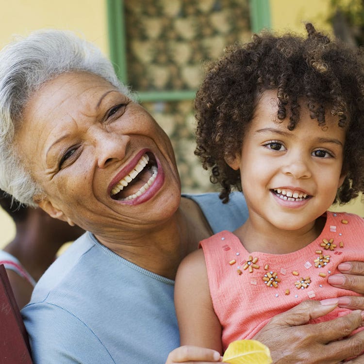 Older women and young girl laughing