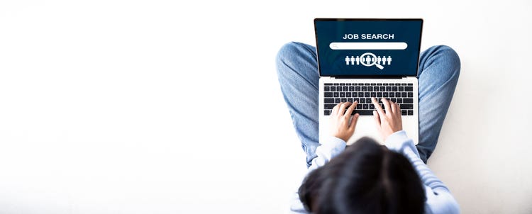 person on laptop browsing jobs - search mammotome jobs