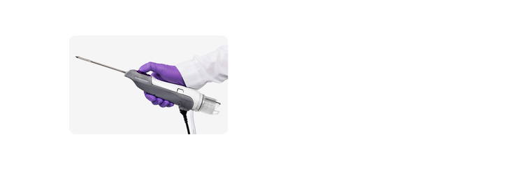 Mammotome Revolve Ultrasound device held in gloved hand