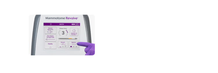 Mammotome Revolve screen with gloved finger pointing to needle aperture control button